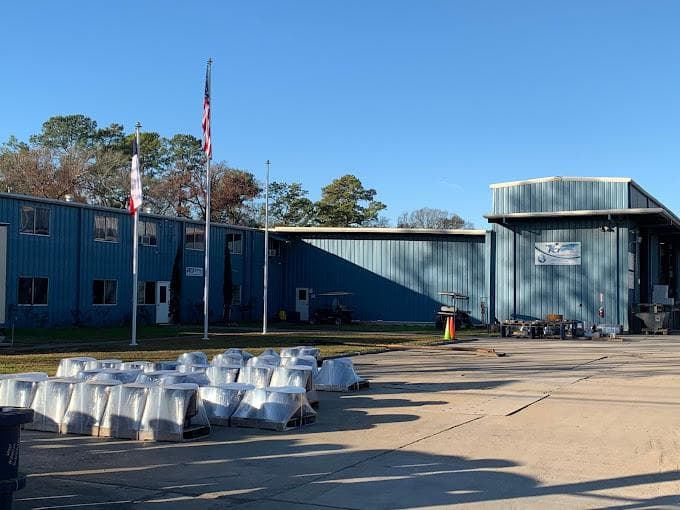 The Humble headquarters with rows of finished nozzles in the foreground