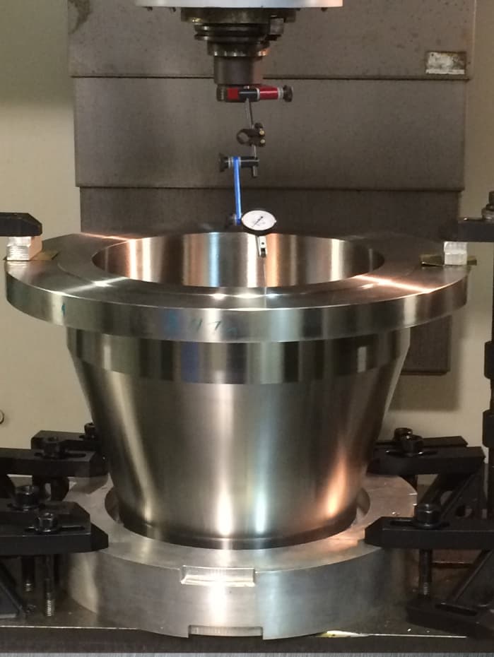 A nozzle forging on a vertical turret lathe table