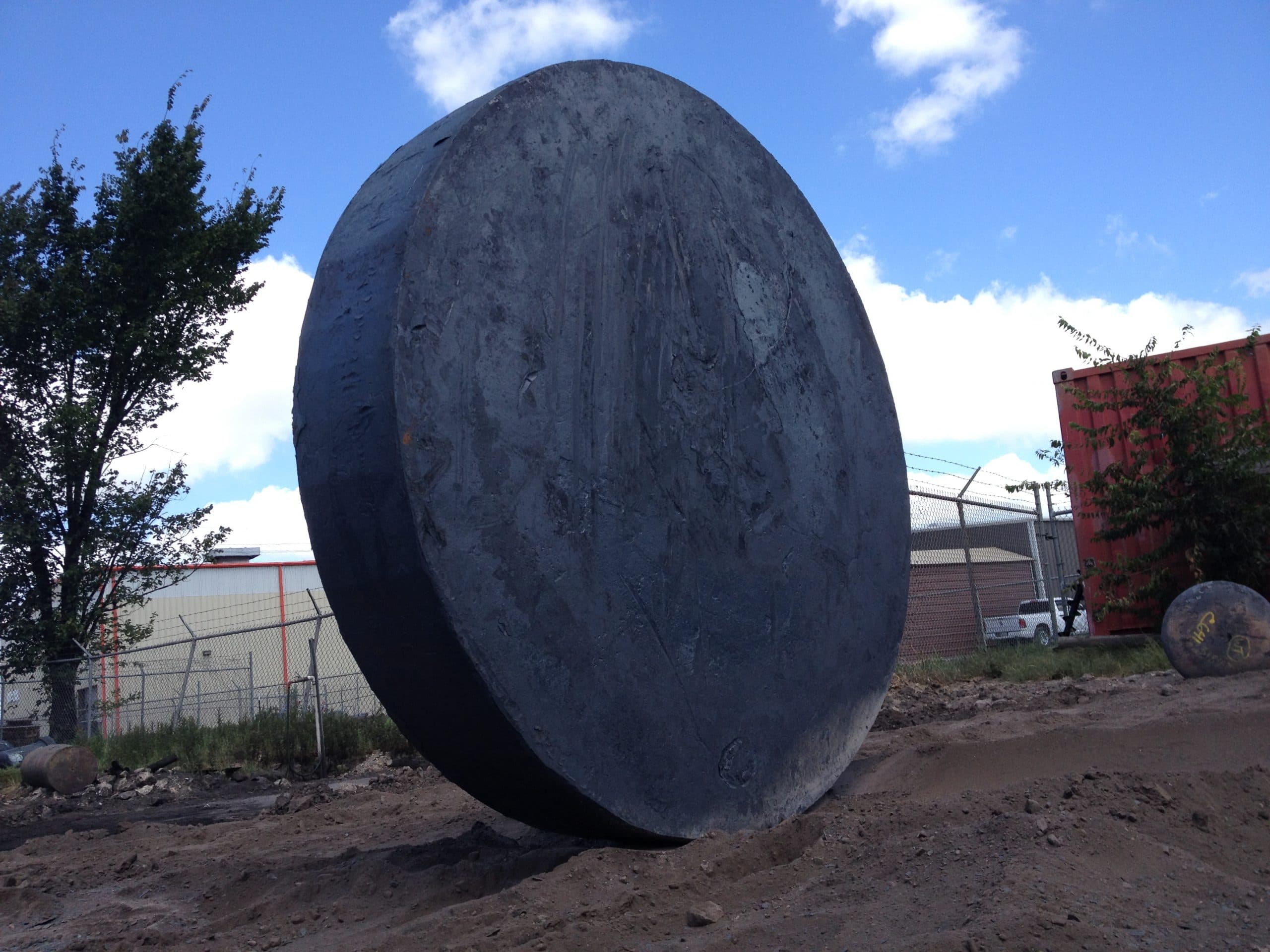 A very large forged disc standing on edge