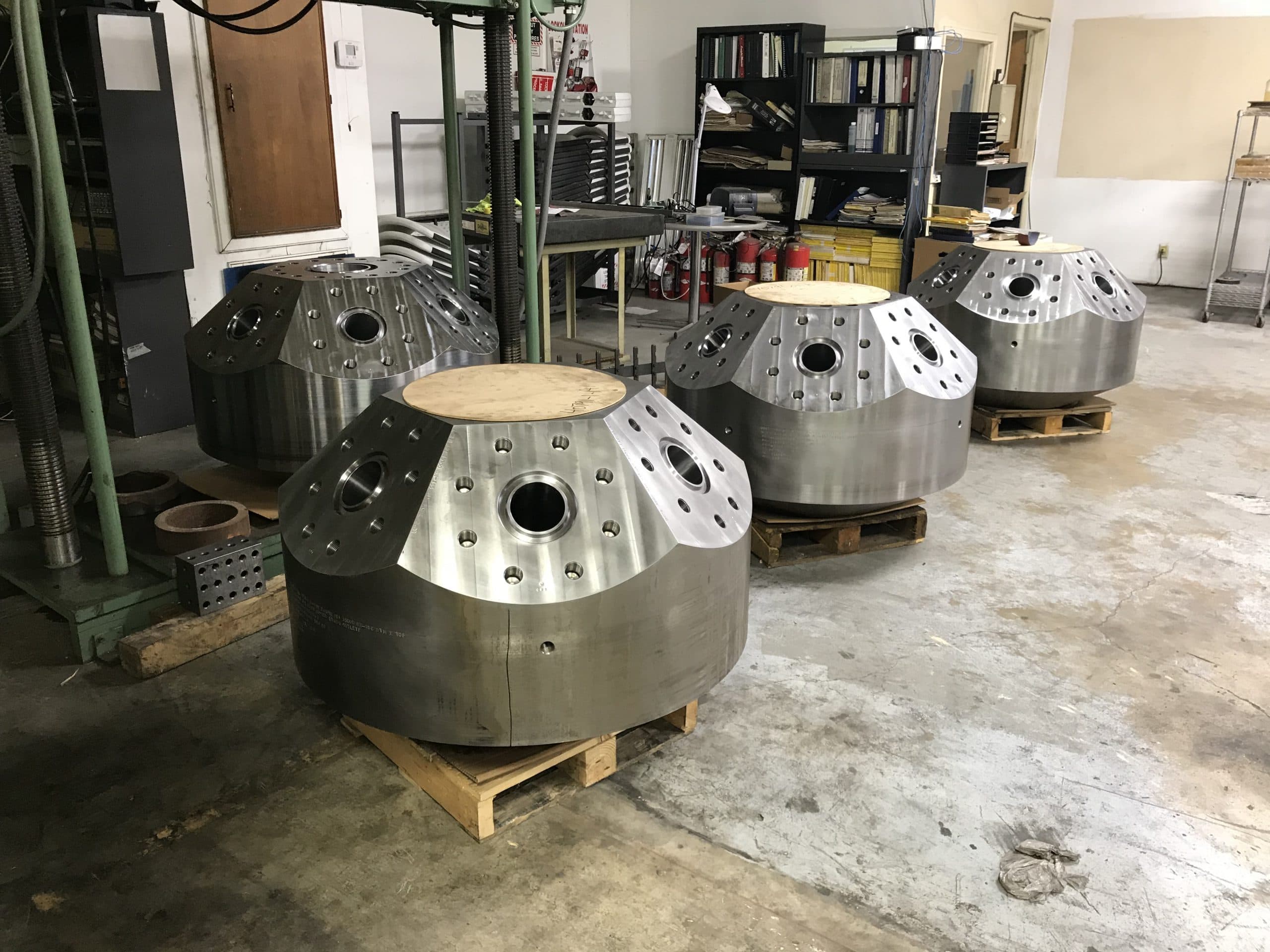 Several machined goat heads in the shop